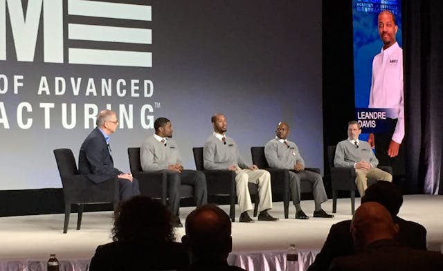 Joe Allie, business manager, global competency, for Rockwell Automation, moderates a panel discussion with four of the first graduates of the Academy of Advanced Manufacturing (from left to right): Chris Allison, Dre Davis, Travis Tolbert and Scott Bingham.