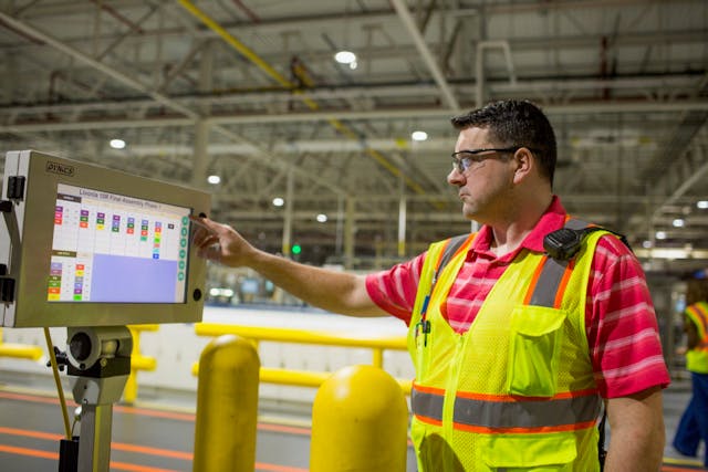 Ryan Keith, Ford Motor Company employee, reviews data in the HMI to track complexity and product flow at Livonia Transmission Plant. Source: Ford Motor Co.