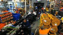 Daimler’s truck assembly plant includes 1,500 ft chassis assembly lines with more than 125 workstations on each. Daimler’s truck assembly plant includes 1,500 ft chassis assembly lines with more than 125 workstations on each.