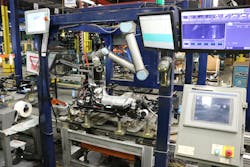 The inspection system includes a UR10 cobot and a Keyence CA-HX200C LumiTrax vision system. The inspection system includes a UR10 cobot and a Keyence CA-HX200C LumiTrax vision system.