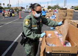Distribution of supplies to address problems created by the COVID-19 pandemic, like this food distribution operation in Las Vegas, can be impacted by numerous supply chain issues.