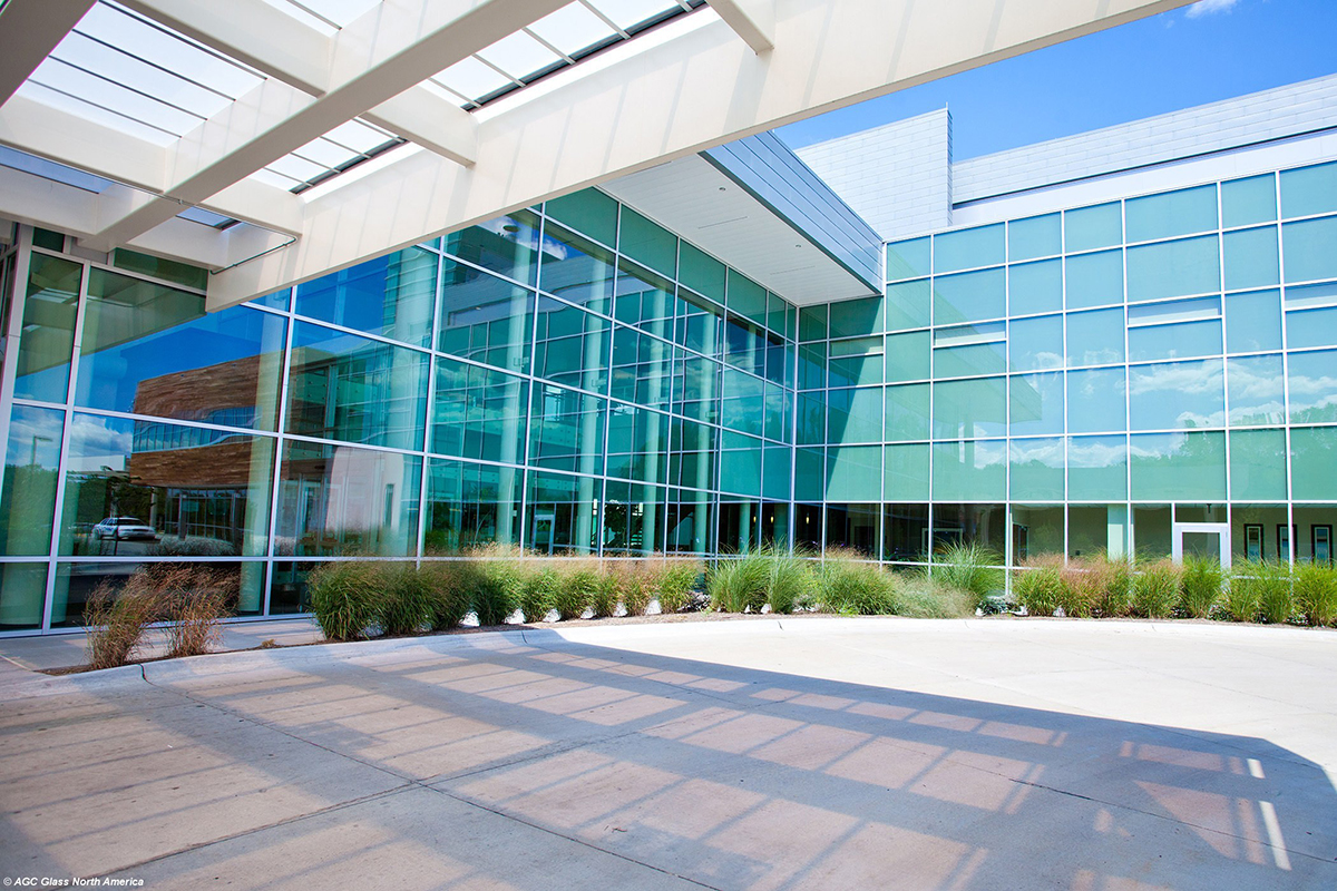 High-efficiency glass is made possible through a sputter coating line, which adds a metallic film to the glass surface. Source: AGC Glass