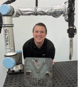 Josh Pawley of Vectis Automation, shown with the cobot welding tool.