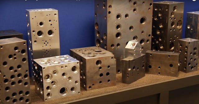 Large manifold block examples that Tomeson workers can now focus more time on with the cobot and gripper handling the smaller blocks.