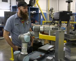 Geoffrey Rose, secondary operations lead and quality supervisor at Tomeson, supervises cobot and gripper handling of part engraving. Geoffrey Rose, secondary operations lead and quality supervisor at Tomeson, supervises cobot and gripper handling of part engraving.