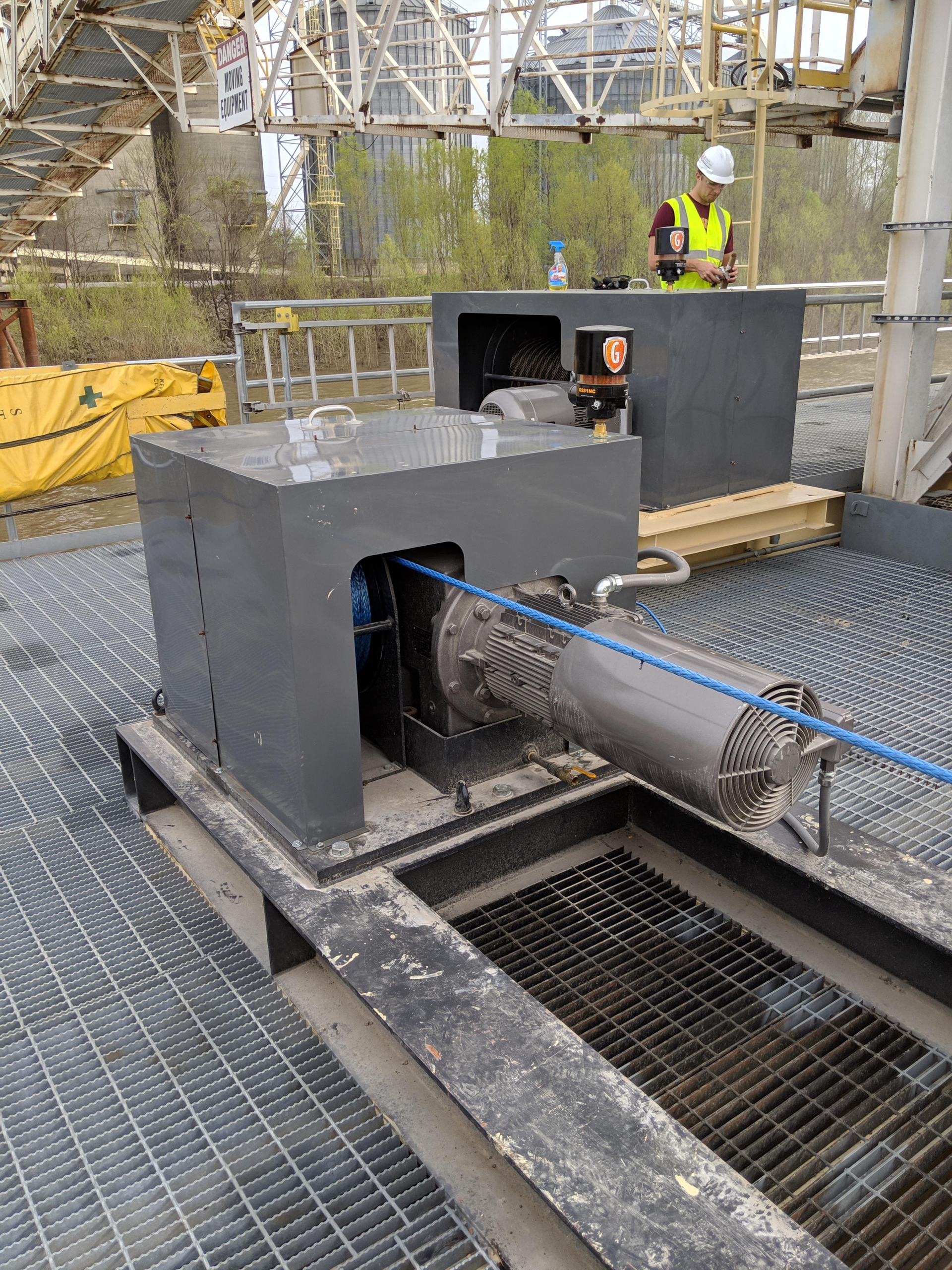 SLM synthetic rope barge breasting winch with NORD gearmotor at an inland grain elevator.