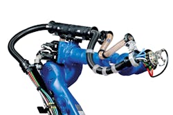 Cables and hoses are routed in conduit around the robot to protect them against the robot’s movements and application environment. Cables and hoses are routed in conduit around the robot to protect them against the robot’s movements and application environment.