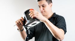 A technician calibrates an Inspekto S70 autonomous machine vision system. A technician calibrates an Inspekto S70 autonomous machine vision system.