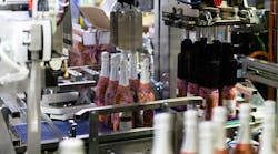 Smooth handling of bottles and partitions at Chandon is a hallmark of the end-of-line Wrap-Around case packer.