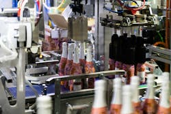 Smooth handling of bottles and partitions at Chandon is a hallmark of the end-of-line Wrap-Around case packer. Smooth handling of bottles and partitions at Chandon is a hallmark of the end-of-line Wrap-Around case packer.