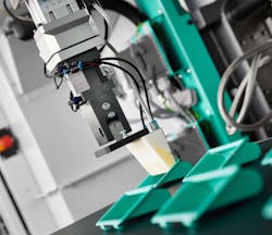 The 3D-printed gripper attached to the robot arm is designed to remove specially designed injection molded parts. Source: Arburg The 3D-printed gripper attached to the robot arm is designed to remove specially designed injection molded parts. Source: Arburg