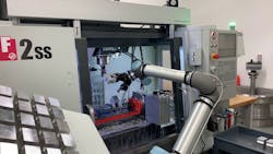 A UR10e cobot from Universal Robots tends a Haas VF-2SS vertical machining center. Source: Fusion OEM