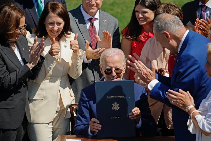 President Biden signs CHIPS and Science Act.