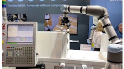 The Robotiq machine tending system using a Universal Robot cobot at IMTS 2022.