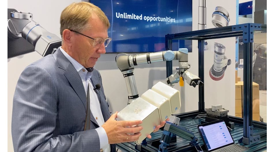 Enrico Krog Iversen, CEO of OnRobot, demonstrates the D:Ploy system at IMTS 2022.
