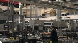 Workers monitor the packaging line at Anheuser-Busch’s facility in St. Louis. Workers monitor the packaging line at Anheuser-Busch’s facility in St. Louis.