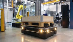 Top load mobile robot delivering pallet to robotic workcell. Top load mobile robot delivering pallet to robotic workcell.