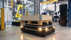 Top load mobile robot delivering pallet to robotic workcell.