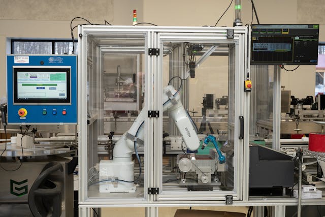 The robotic print-and-apply system at SunMed Growers features an Epson ColorWorks industrial, on-demand color label printer and Epson&rsquo;s VT6L six-axis robot.