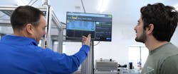 Rick Schilling, owner of IPSi, and Justin Garcia, compliance manager at SunMed Growers, review data on the automated labeling system's HMI. Rick Schilling, owner of IPSi, and Justin Garcia, compliance manager at SunMed Growers, review data on the automated labeling system's HMI.