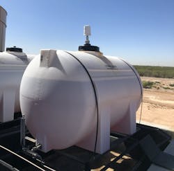 A SignalFire Ranger transmitting storage tank level data from the field.