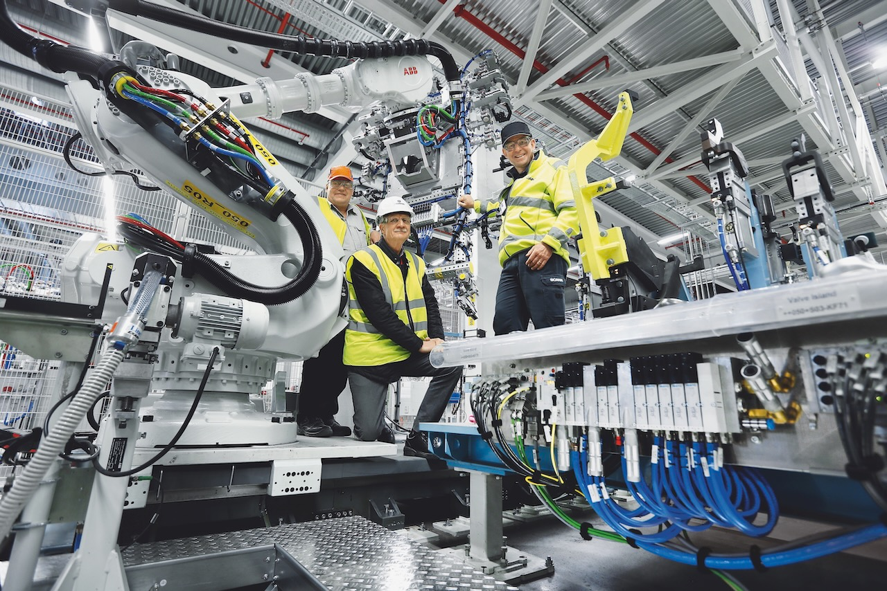 Panel parts are clamped in pneumatically actuated devices and welded, controlled by Festo&rsquo;s CPX/VTSA valve manifolds. Evert Forsberg (left), Lars Kreutner (right), both from Scania, and Leif Lindahl (center) from Festo.