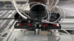 A custom Rapid Robotics' robot gripper for COVID PCR test kit assembly. A custom Rapid Robotics' robot gripper for COVID PCR test kit assembly.