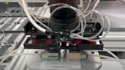 A custom Rapid Robotics' robot gripper for COVID PCR test kit assembly. A custom Rapid Robotics' robot gripper for COVID PCR test kit assembly.