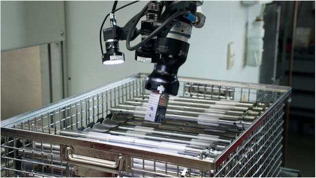 A MirAI-guided collaborative robot automates handling of metal parts for washing at HWL.
