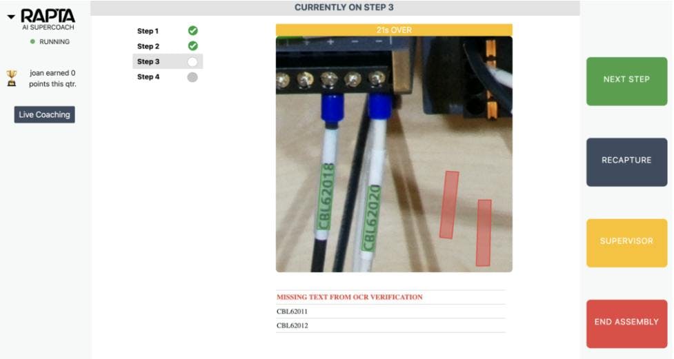This screenshot shows how the Rapta platform highlights a problem area for the operator. In this example, the Rapta platform expects to see two wires and labels connected to the component (at right). The platform notifies the operator and indicates where the missing wires and labels should be in a correct assembly. This screenshot shows how the Rapta platform highlights a problem area for the operator. In this example, the Rapta platform expects to see two wires and labels connected to the component (at right). The platform notifies the operator and indicates where the missing wires and labels should be in a correct assembly.