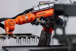 An articulated KUKA robot loads and unloads the PECM chamber, relying on advanced kinematics found in TwinCAT 3 automation software. (&copy; Beckhoff, 2024)