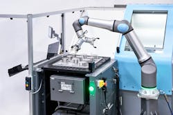 Universal Robot’s UR30 in a machine tending application. Universal Robot’s UR30 in a machine tending application.