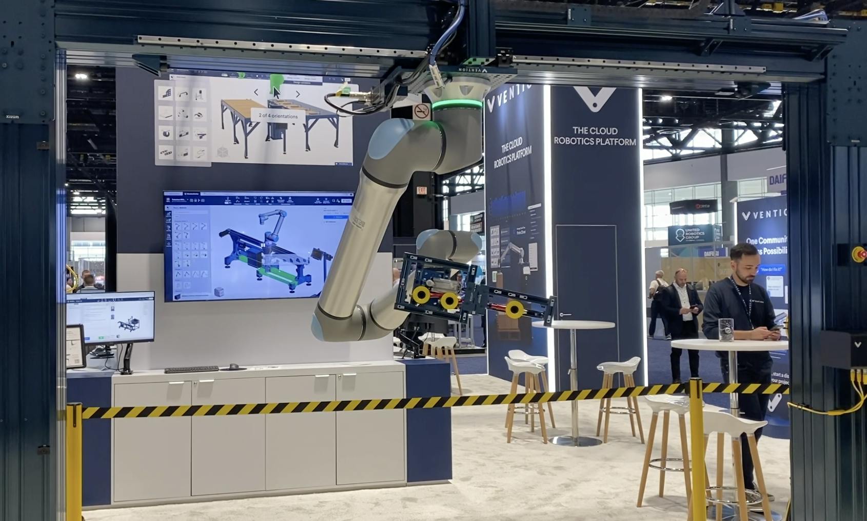 A gantry robot workcell designed and built with Vention components and featuring a UR cobot in Vention's Automate 2024 exhibit.