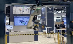 A gantry robot workcell designed and built with Vention components and featuring a UR cobot in Vention's Automate 2024 exhibit. A gantry robot workcell designed and built with Vention components and featuring a UR cobot in Vention's Automate 2024 exhibit.