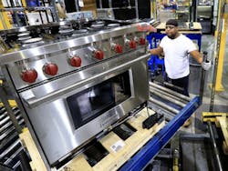 A Wolf range from Sub-Zero moving through the assembly process. A Wolf range from Sub-Zero moving through the assembly process.