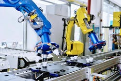 Robots on a manufacturing line Robots on a manufacturing line