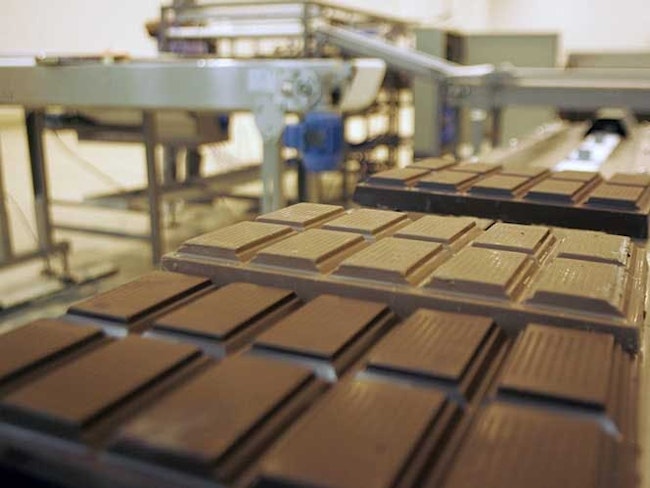 Chocolate bars from Barry Callebaut move along a conveyor belt