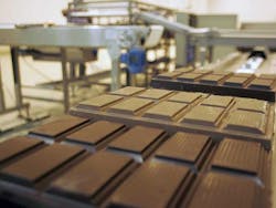 Chocolate bars from Barry Callebaut move along a conveyor belt Chocolate bars from Barry Callebaut move along a conveyor belt