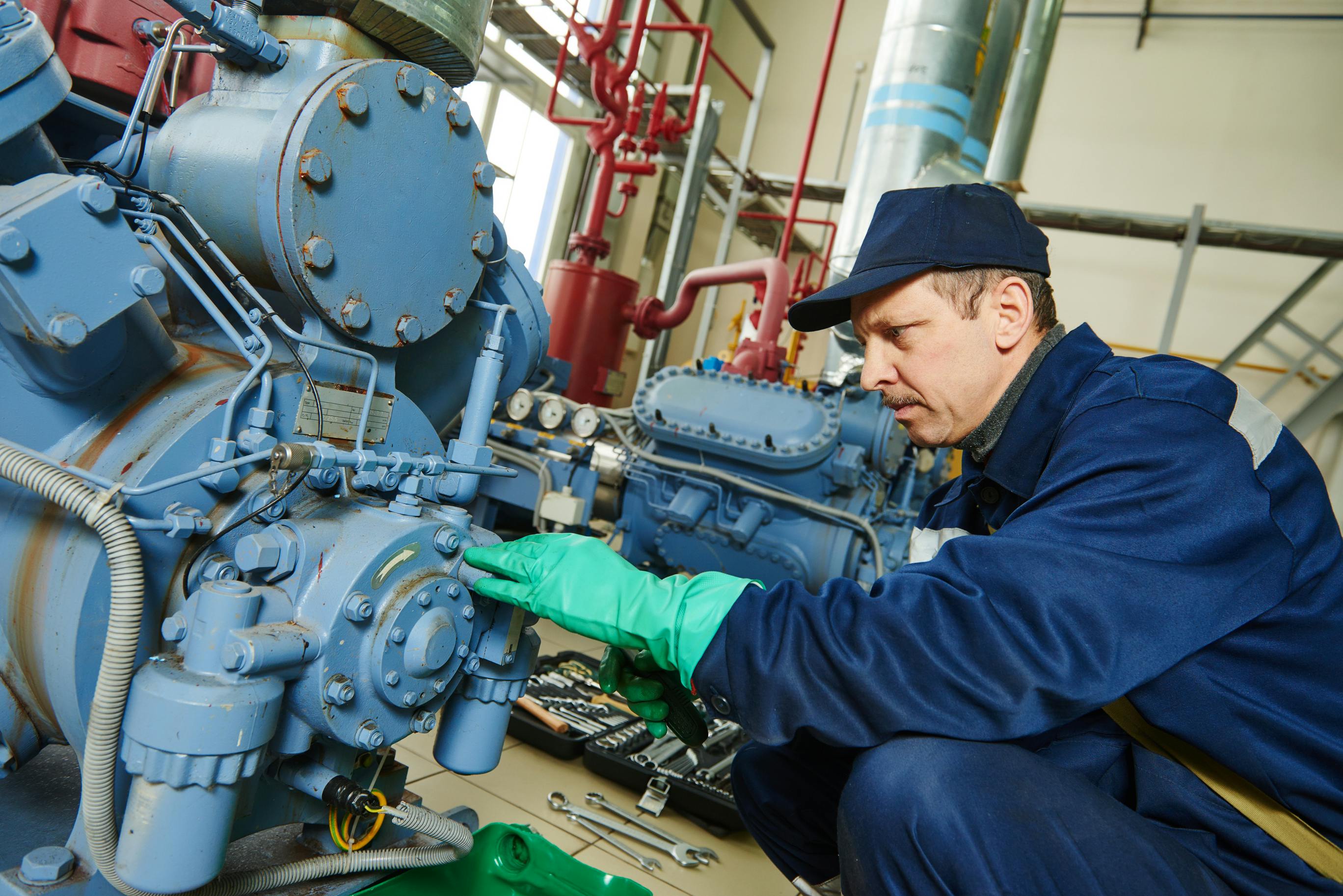 maintenance technician at work in manufacturing facility