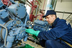 maintenance technician at work in manufacturing facility maintenance technician at work in manufacturing facility