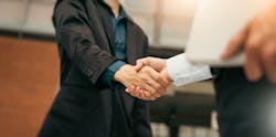 Businessman handshake for teamwork of business merger and acquisition Businessman handshake for teamwork of business merger and acquisition
