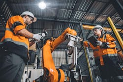 manufacturing engineers with robot manufacturing engineers with robot