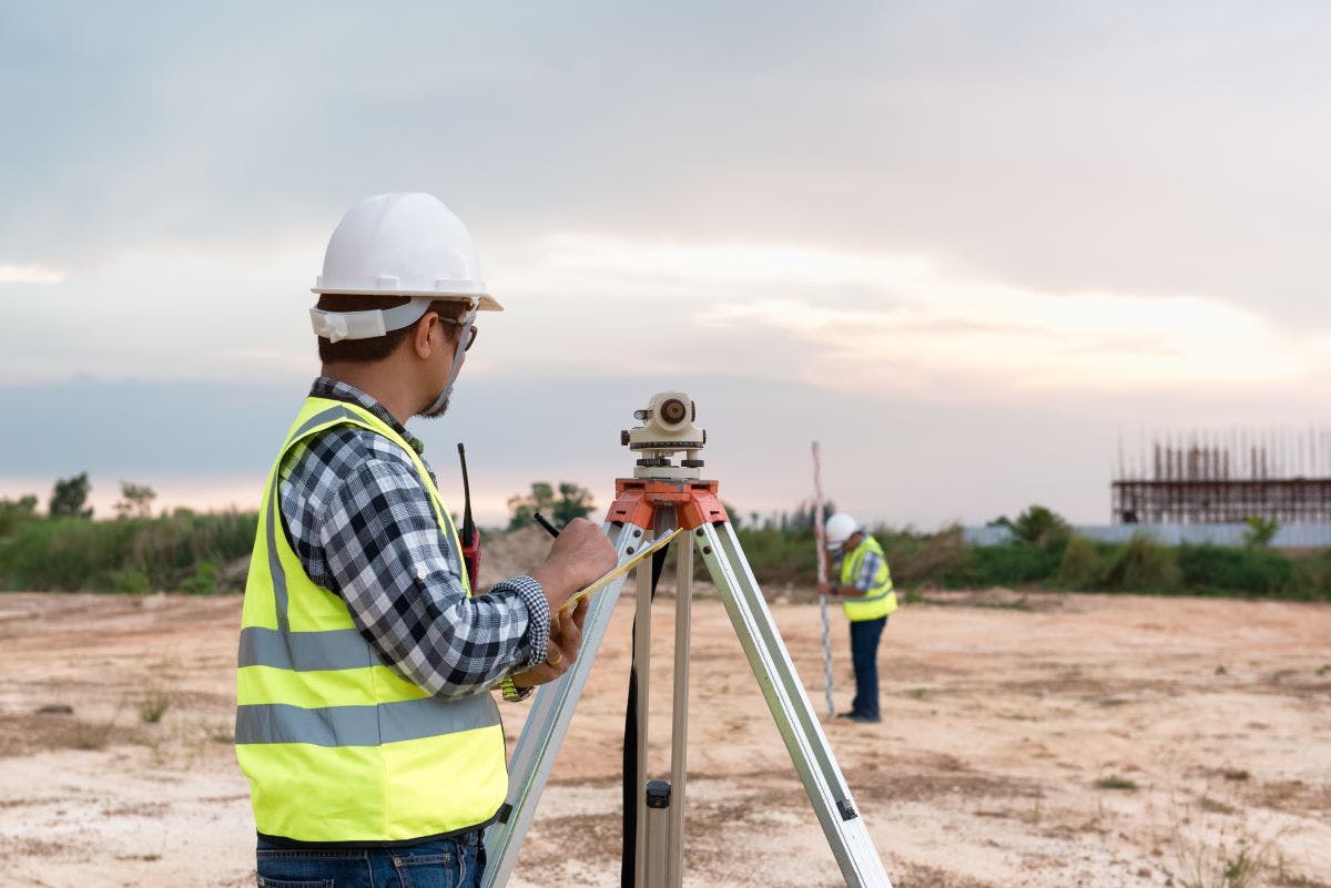 Surveyor&rsquo;s telescope at construction site