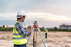 Surveyor’s telescope at construction site Surveyor’s telescope at construction site