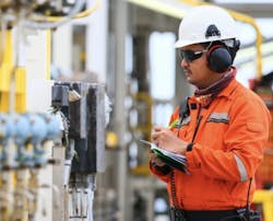 engineer checking devices at a process plant engineer checking devices at a process plant
