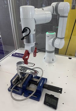 This RBTX system, consisting of a six-axis arm and work cell, inspects faucets for proper functionality. This RBTX system, consisting of a six-axis arm and work cell, inspects faucets for proper functionality.