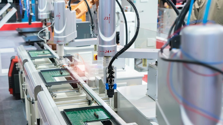 robots with vision systems in electronics assembly