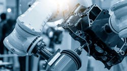 The automotive parts finishing process by milling spindle attached the robotics arm. The hi-technology automotive parts manufacturing process by robotics system. The automotive parts finishing process by milling spindle attached the robotics arm. The hi-technology automotive parts manufacturing process by robotics system.