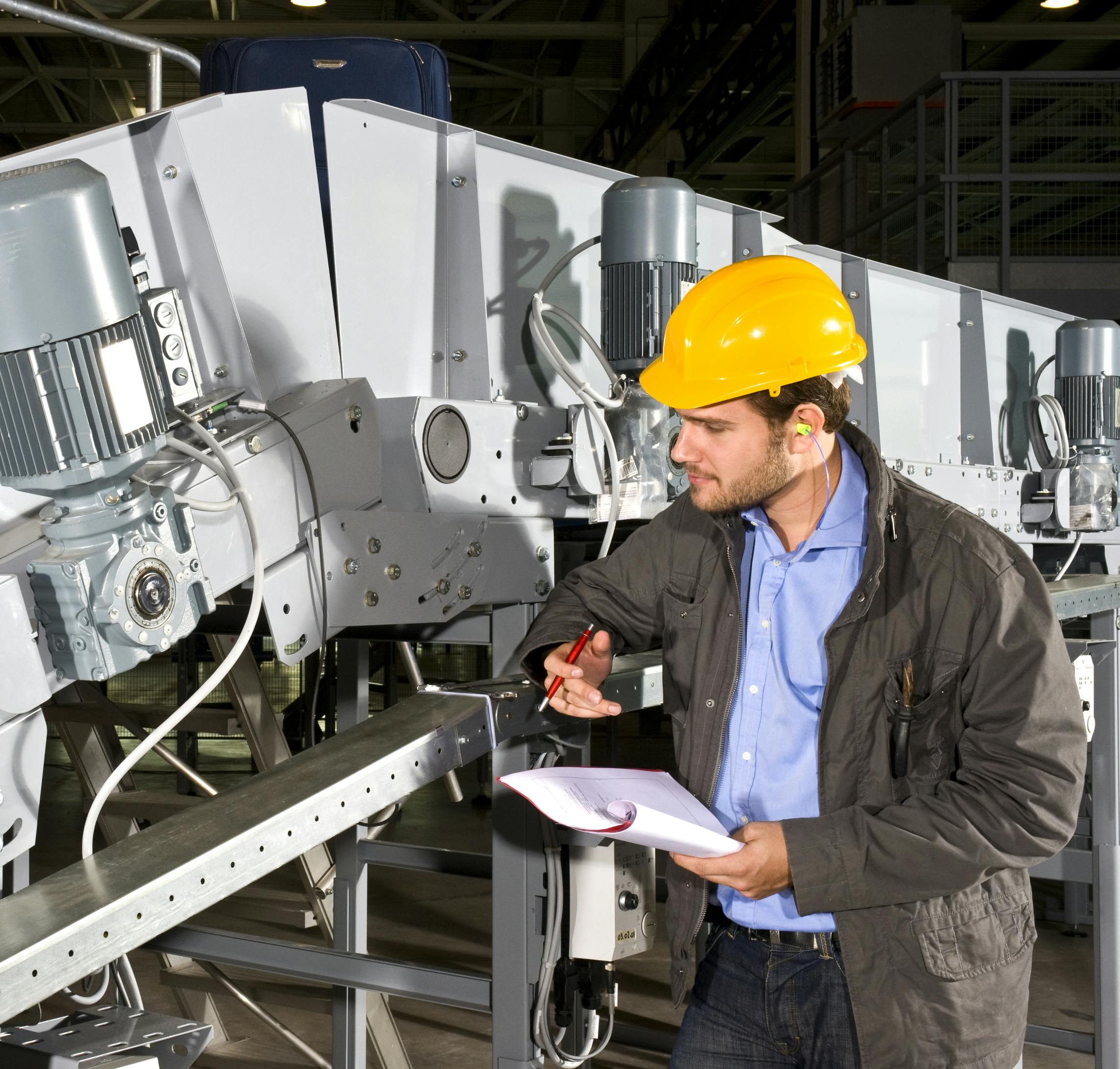 plant maintenance technician checking equipment