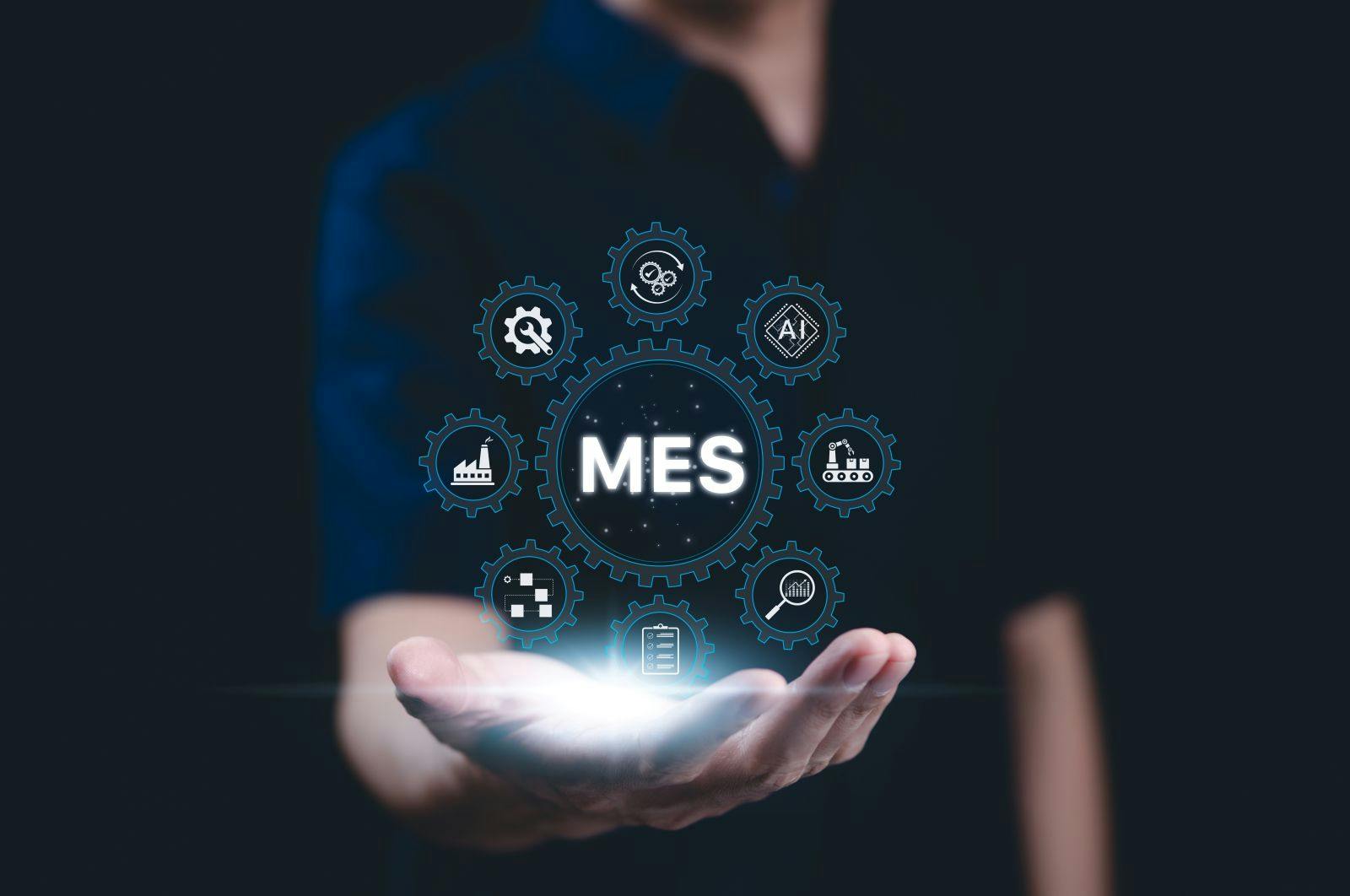 MES - Manufacturing Execution System Concept. A person presents a glowing MES icon with digital symbols related to manufacturing, automation, industrial processes, technology in production management,